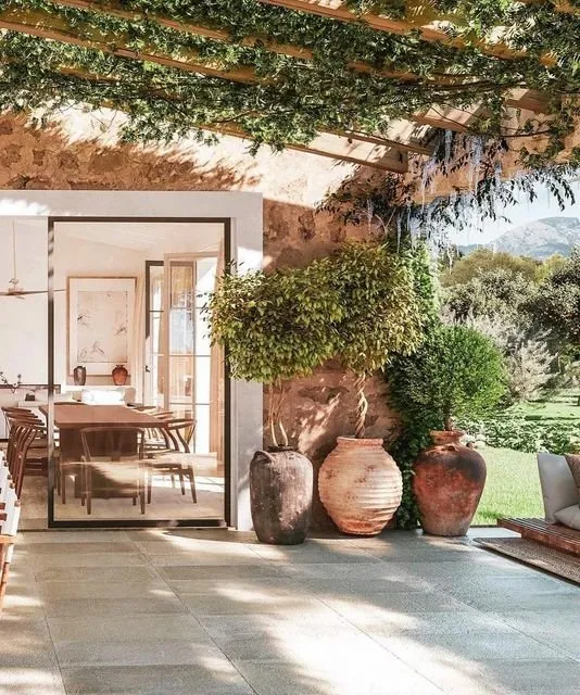 View through a terrace into a bright Mediterranean dining room